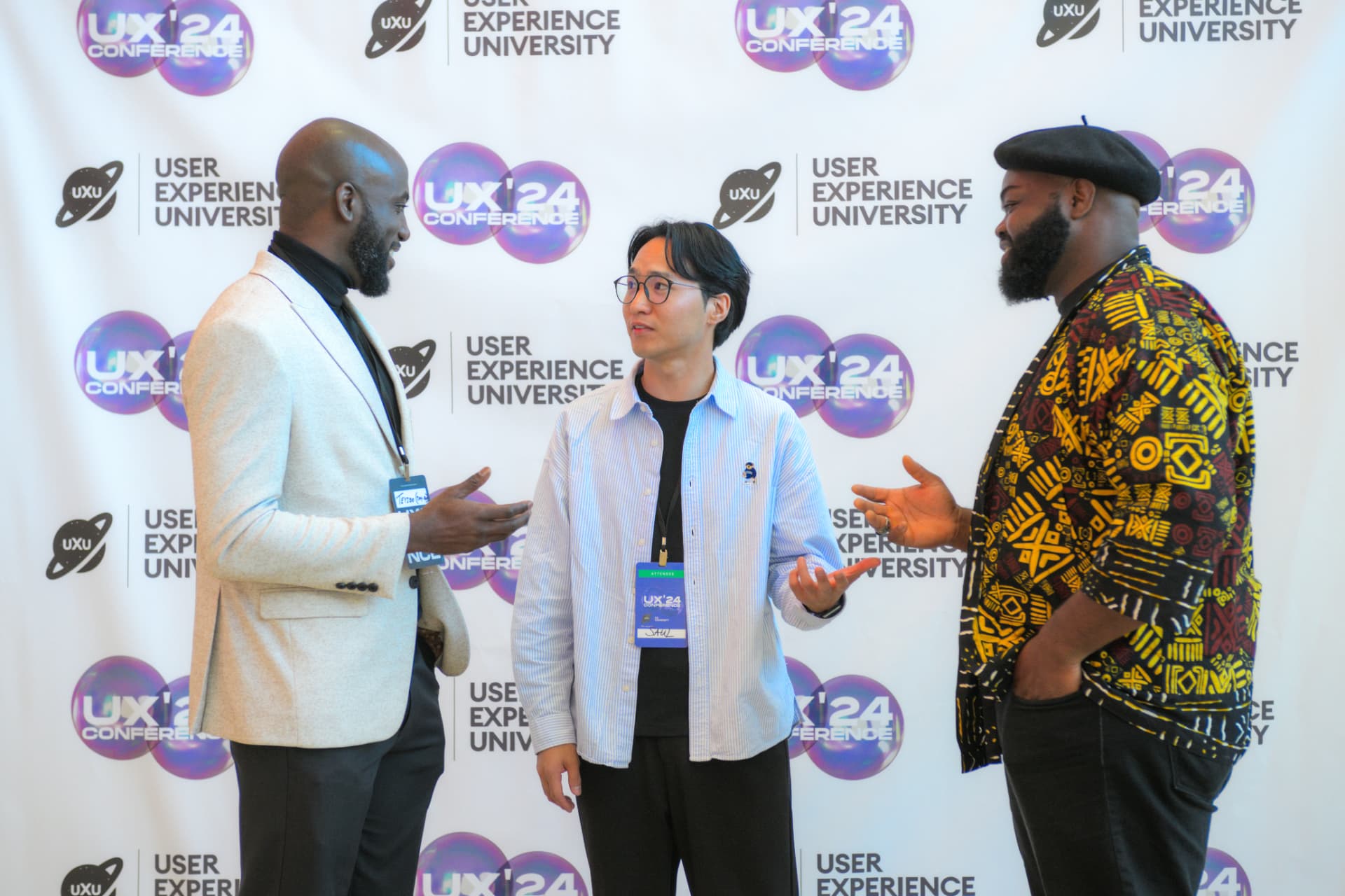 Attendees talking together at a UXU event