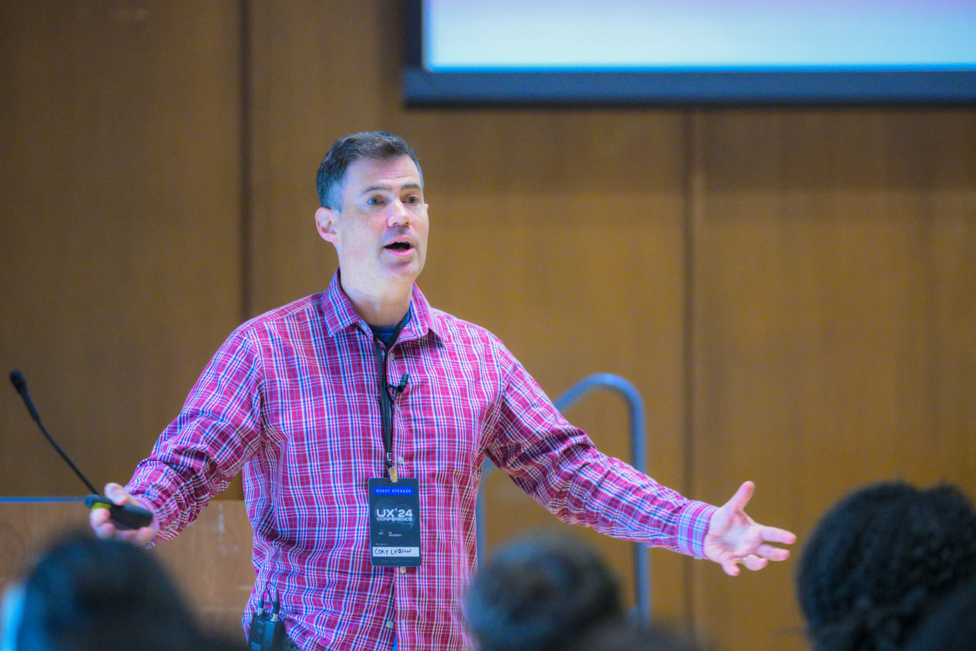 A UXCON speaker presenting on stage