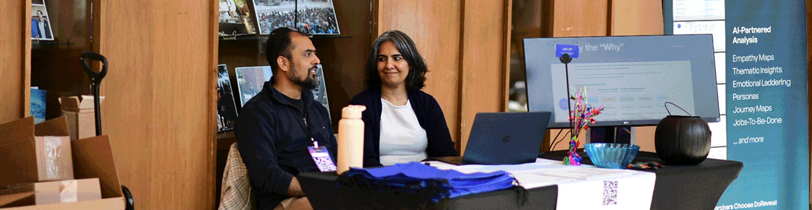 Facilitators and participants working together at a UXU workshop table